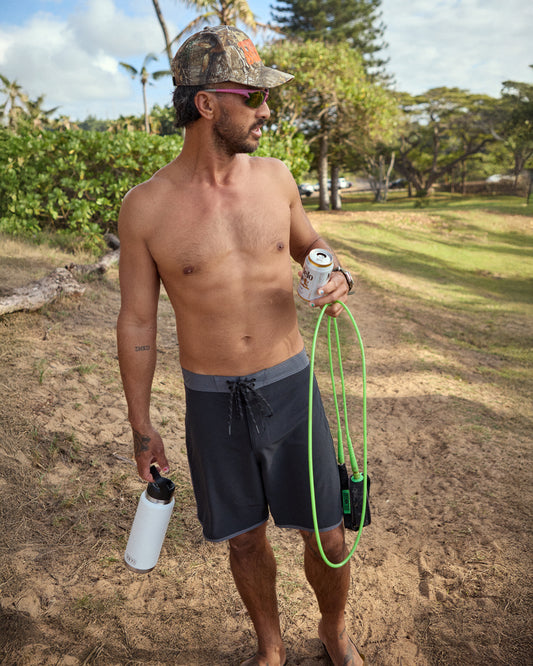 Man wearing black boardshorts