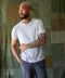 Man wearing a gray Sojourn tee by Outerknown, a men's short-sleeved t-shirt made with Peruvian Pima cotton.