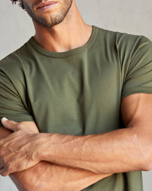 Closeup of man wearing a green crew-neck t-shirt