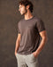A brown crew-neck t-shirt with a front pocket, made from Peruvian Pima cotton.