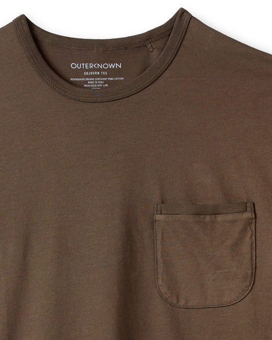 A brown crew-neck t-shirt with a front pocket, made from Peruvian Pima cotton.