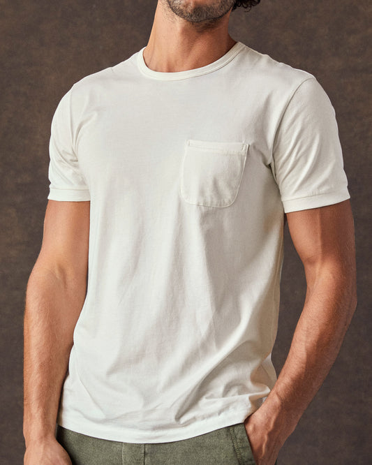 A white, short-sleeved t-shirt with a pocket on the chest.