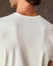 A white, short-sleeved t-shirt with a pocket on the chest.