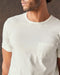 A white, short-sleeved t-shirt with a pocket on the chest.