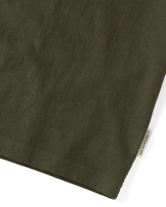 Closeup of 'Outerknown' tag on seem of olive green short sleeve t-shirt