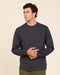 Washed black long-sleeve crewneck tee, relaxed fit with ribbed cuffs and hem