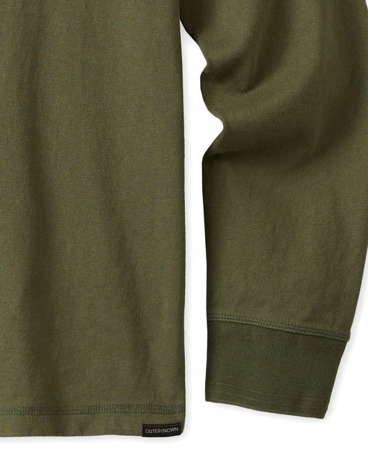 Hemline and long sleeve of olive green long-sleeved t-shirt