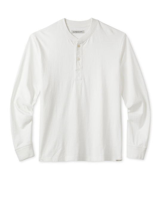 A white long-sleeved henley shirt with a ribbed neckline and cuffs, featuring a two-button placket and fish-eye corozo nut buttons.