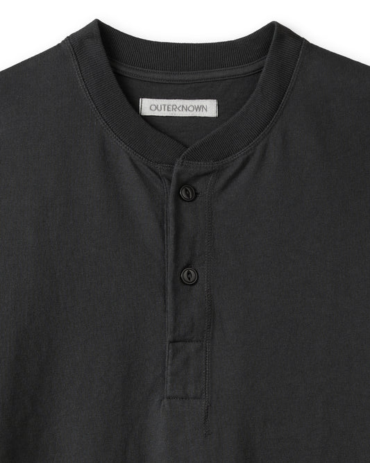 Collar and buttons on black henley shirt
