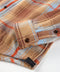 Plaid shirt with chest flap pockets and dark button details in tan and orange