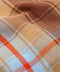 Woven plaid fabric close-up in tan, blue, and orange with textured pattern