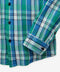 Close-up of the shirt's plaid fabric, button front, and buttoned cuff