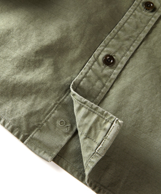 Closeup of logo on utilitarian shirt