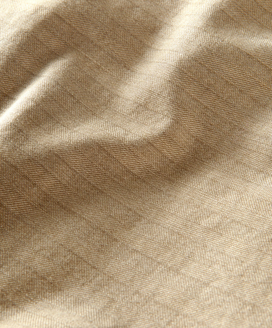 Closeup of materials of beige utilitarian shirt