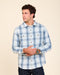 Light blue plaid button-up shirt with collar, buttons, and two chest pockets