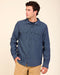 Indigo denim button-up with pointed collar, chest flap pockets, long sleeves