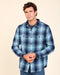Men's blue plaid blanket shirt with snap front and two chest pockets