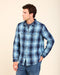 Men's blue plaid blanket shirt with snap front and chest pockets, side view