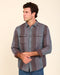 Striped button-up shirt with two chest pockets, button front, long sleeves; blue and rust.