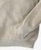 Outerworn nostalgic sweater sleeve cuff and hem; oatmeal textured knit