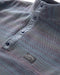 Outerworn French Blue snap popover detail: quilted chevron texture and snap buttons