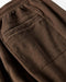 Close-up of brown sweatpants back pocket