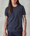 Man wearing navy blue crew neck shirt with a front chest pocket