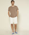 Chalk chino shorts on model, straight legs and front pockets