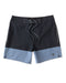 A pair of men's boardshorts with a solid navy blue top half and a blue bottom half, featuring a drawstring waist and a small logo on the left leg.