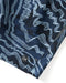 Closeup of logo on blue patterned baordshorts