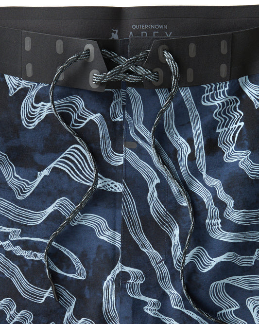 Closeup of drawstring of blue patterned boardshorts