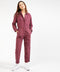 Outerworn plum station jumpsuit with front zipper, chest pocket, and utility seams