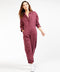 Outerworn plum station jumpsuit, full length with roomy legs and front pockets