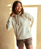 Oatmeal heather hoodie with long sleeves, drawstring hood, and kangaroo pocket