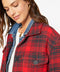 Red-and-black plaid shirt jacket with two snap chest pockets and dark buttons