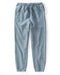 Light blue sweatpants on a white background
