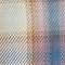 Close-up of a fabric with a plaid pattern in pastel colors.