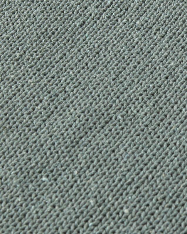Close-up of textured green fabric