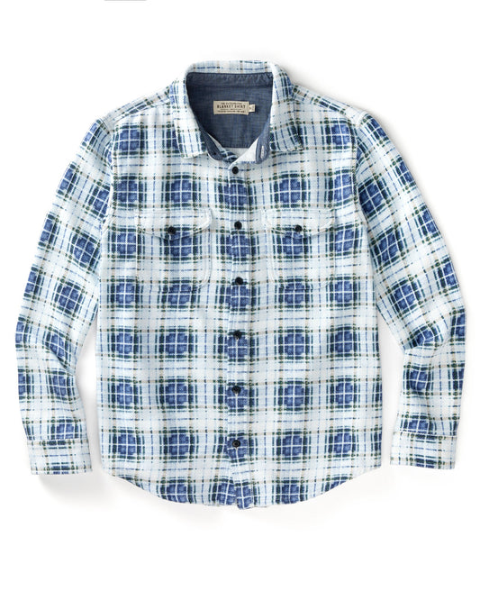Blue and white plaid blanket shirt on white background.