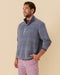 Outerworn French Blue snap popover shirt worn by model, stand collar and long sleeves