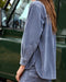 Woman wearing a blue corduroy shirt