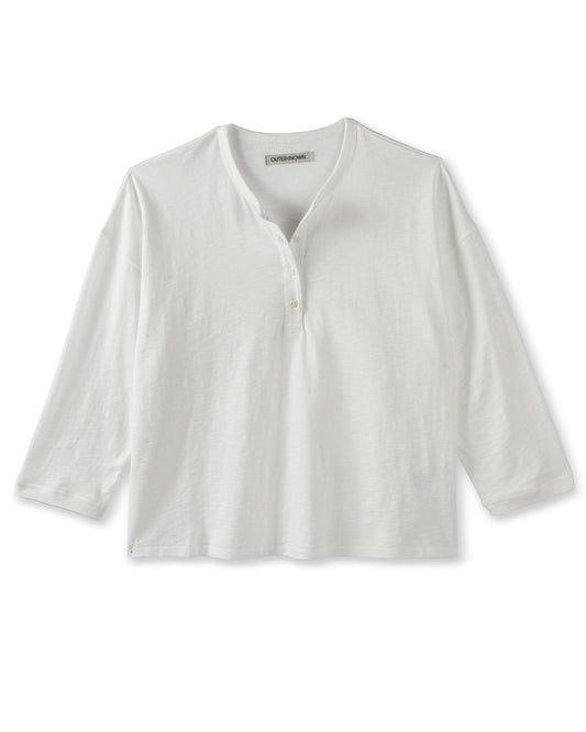 white henley top with a brand label on a white background