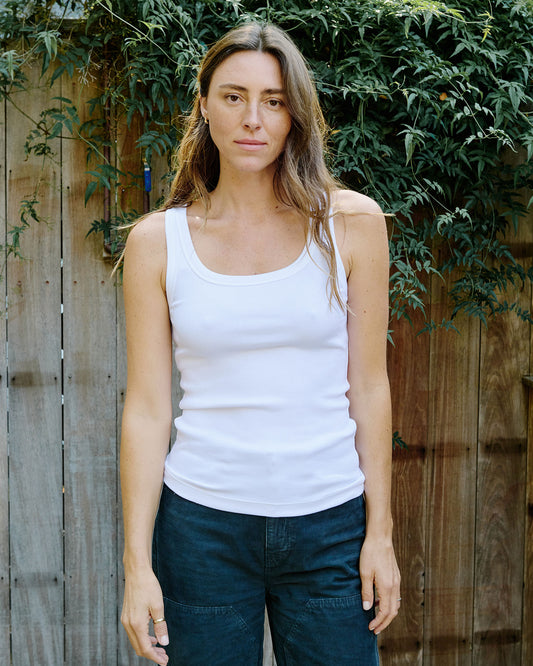 Woman wearing white tank top